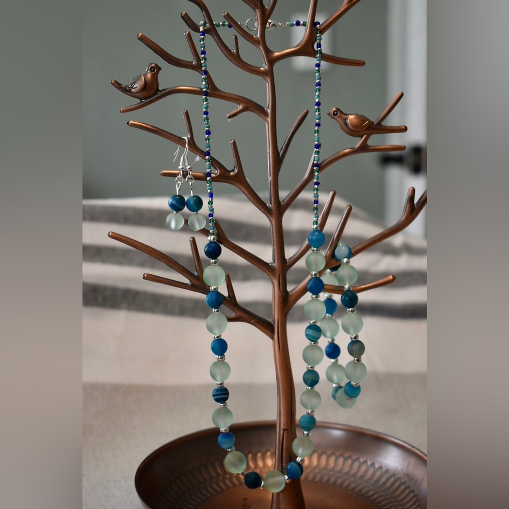 Handmade blue and teal beaded necklace, bracelet and earring set.